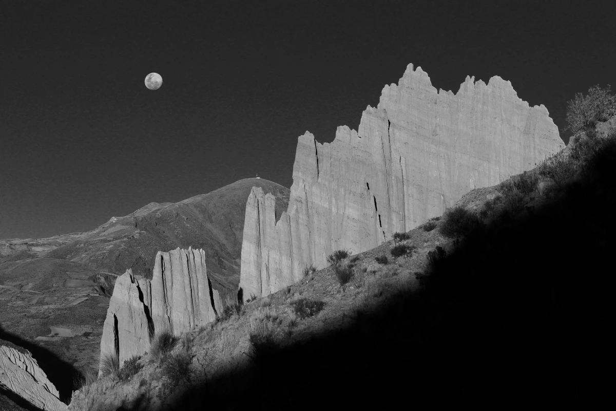Moon over Andean cliffs — B&W