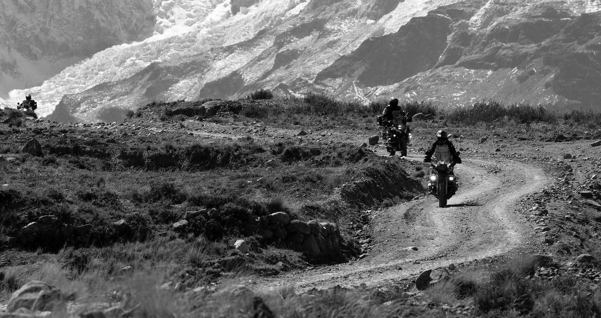 Group ride on glacier trail — Andes, Bolivia