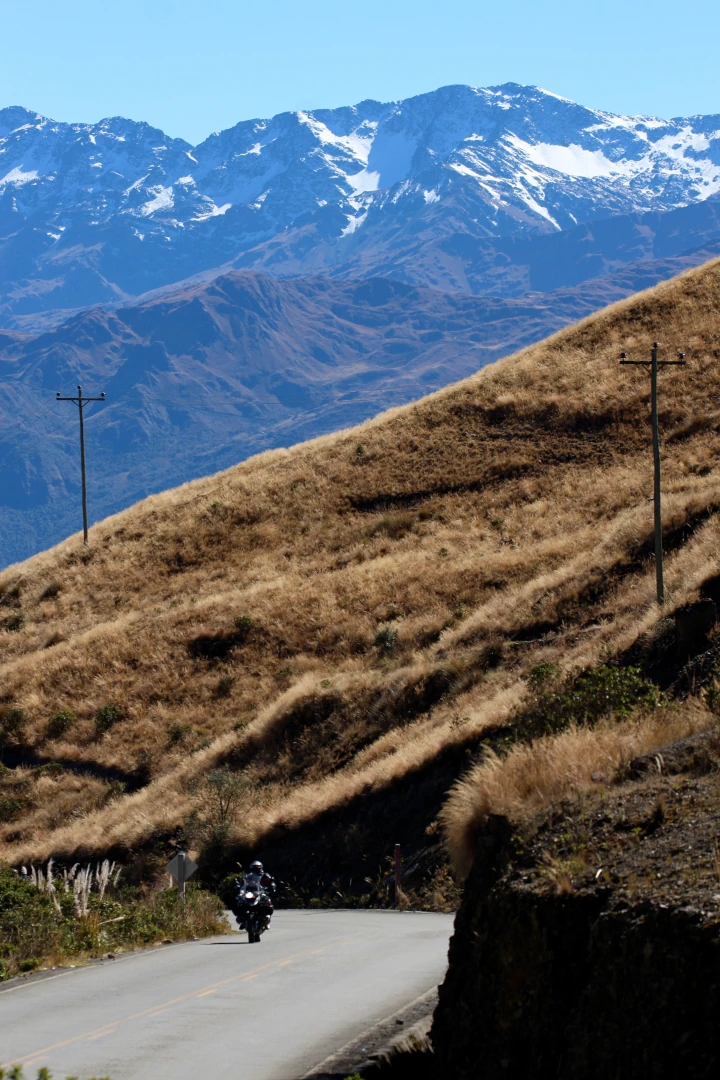 Rider ascending high-altitude Andean pass